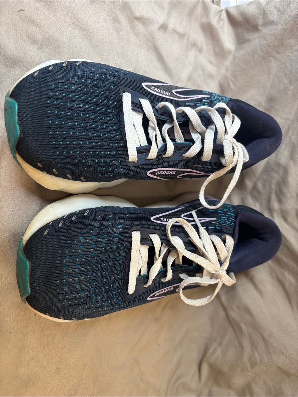 Brooks navy running sneakers with teal and white accents